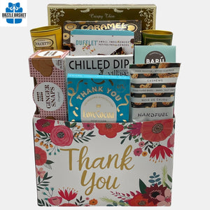 A Calgary Thank you Gift basket that contains delicious gourmet snacks arranged in a "Thank You" cardboard box 