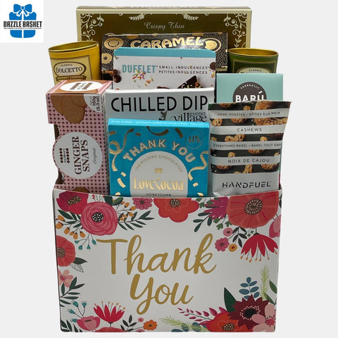 A Calgary Thank you Gift basket that contains delicious gourmet snacks arranged in a "Thank You" cardboard box 