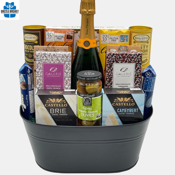 A made in Calgary Champagne gift basket with gourmet products arranged in a black container