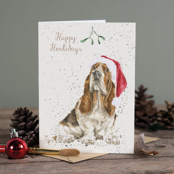 A Christmas greeting card featuring a dog wearing a Christmas cap
