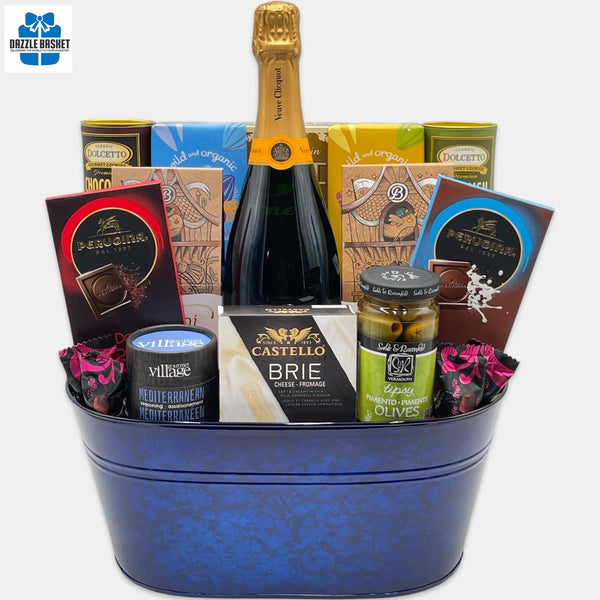 A made in Calgary Champagne gift basket with gourmet products arranged in a blue container