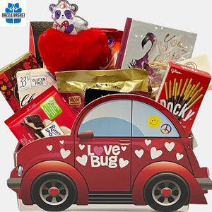 GIft baskets calgary from Dazzle Basket- Great Valentine Day gift that includes lots of chocolates and delicious food products in a beetle car shaped box with Love Bug written on it.