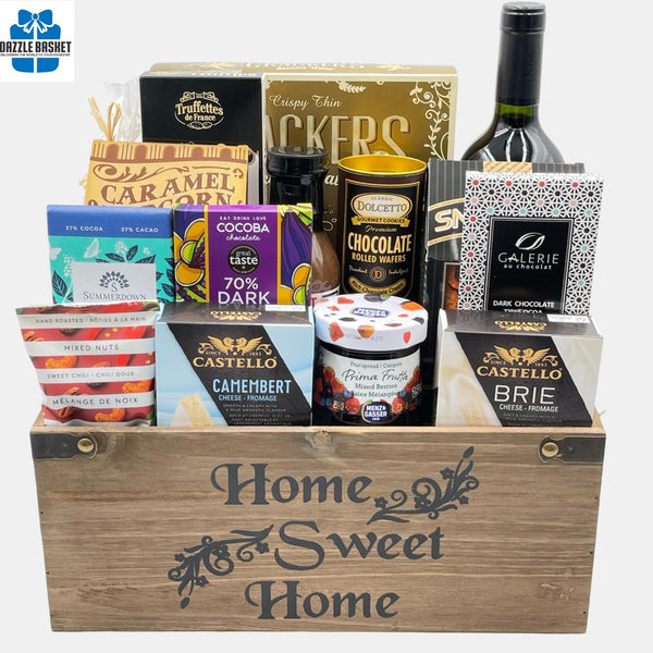 A made in Calgary Housewarming gift basket filled with tasty gourmet treats packed in a wooden basket titled "Home Sweet Home".