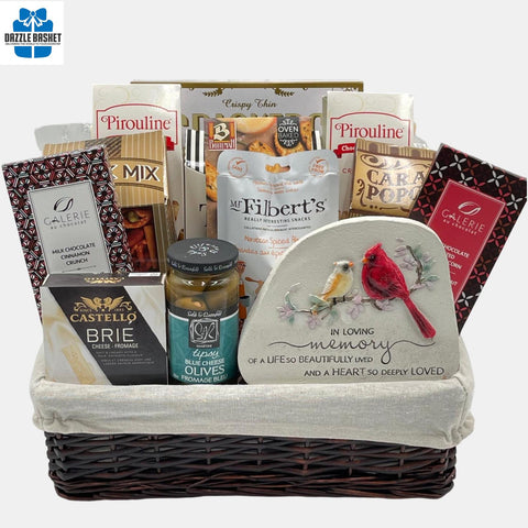 A  Calgary sympathy gift basket comprising of quality gourmet snacks arranged in a willow basket with white linercontainer.