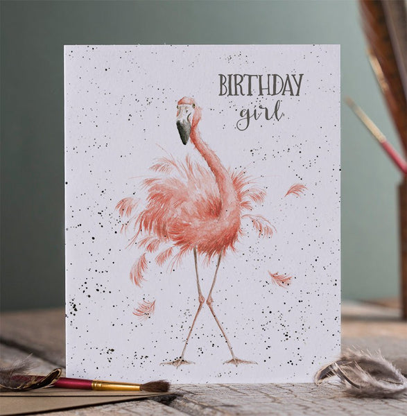A birthday greeting card that depicts a flamingo and is meant for a girl.