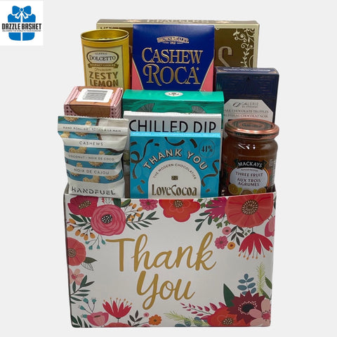 A Calgary Thank you Gift basket that contains delicious gourmet snacks arranged in a "Thank You" box 