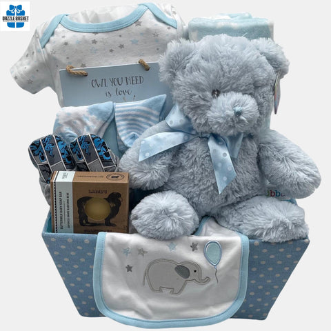 This Calgary baby boy gift basket includes quality products such as clothes, plush toy, shoes, wooden plaque that the new born will simply love.