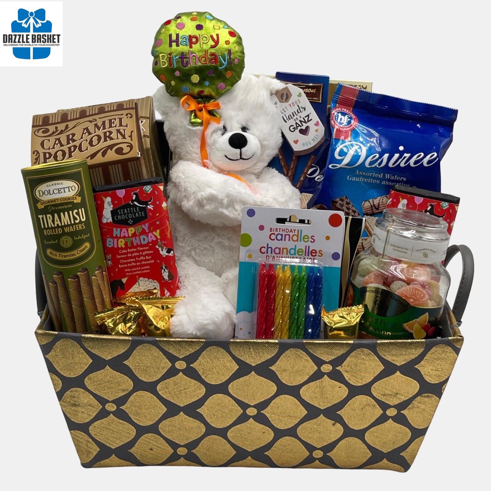 Calgary birthday gift basket that includes a "Happy Birthday" teddy, gourmet snacks, chocolates organized beautifully in a golden blue rectangular basket.