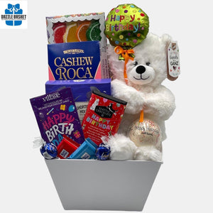 A made in Calgary birthday gift basket that includes delicious gourmet snacks including chocolates packed in a large market tray.