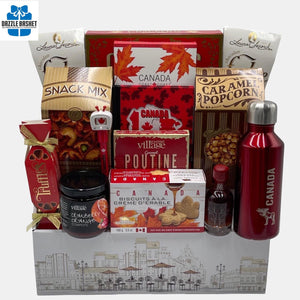 Canada themed food gift basket made in a laddered white box. This made in Calgary gift basket has delicious gourmet snacks.