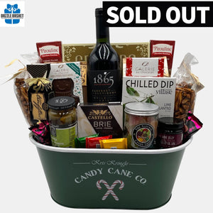 An award winning wine with tasty gourmet snacks placed perfectly in a beautiful Holiday metal container make up this  very popular made in Calgary Holiday gift basket.