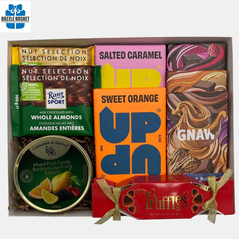 A made in Calgary chocolate gift basket that includes top of the line handmade chocolates in a recangular box with see through lid.