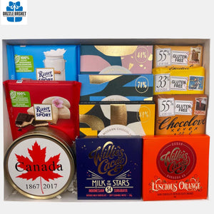 A made in Calgary chocolate gift basket that includes top of the line handmade chocolates in a rectangular white box with see through top.