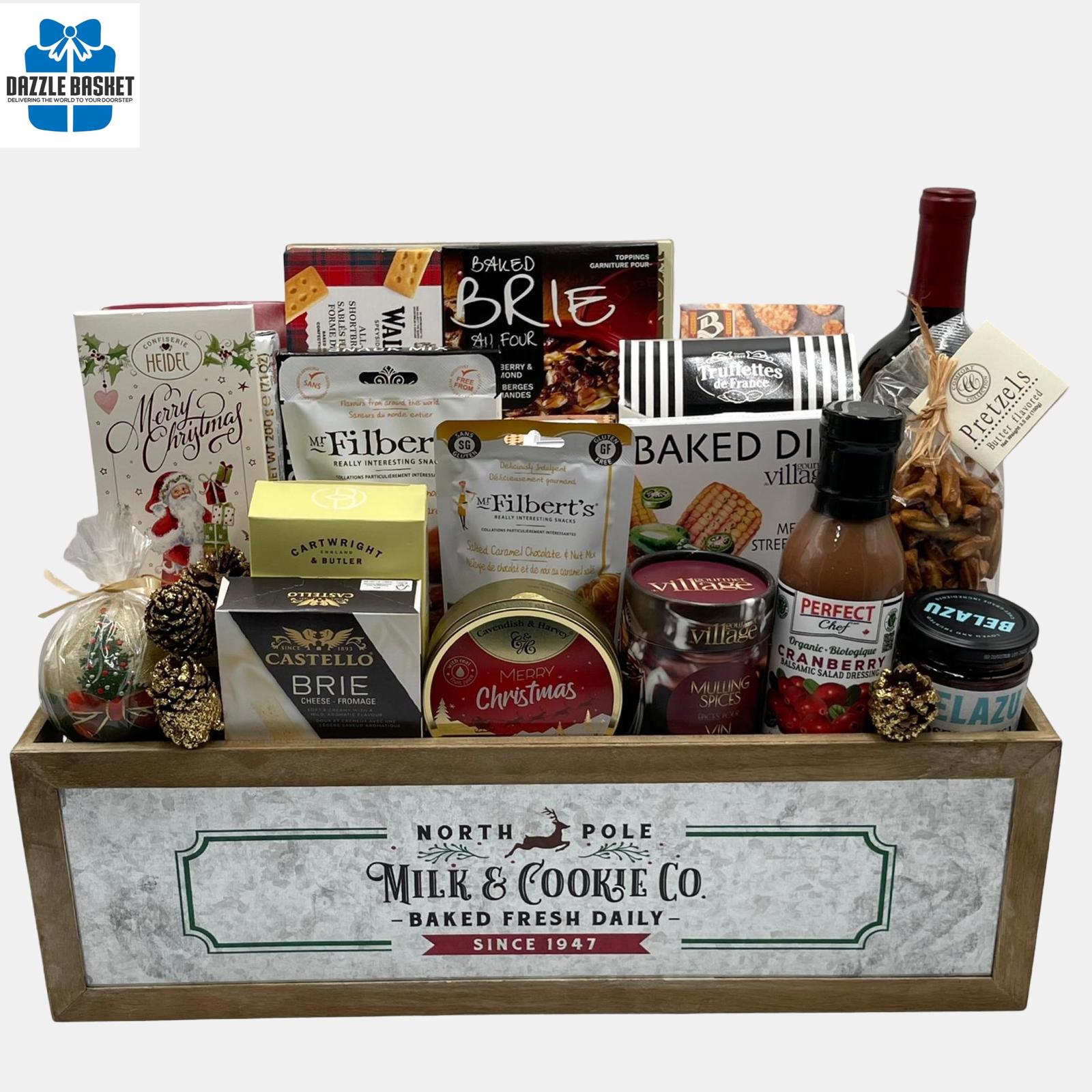 An array of holiday gourmet snacks with an award winning bottle of wine arranged neatly in a holiday themed wooden crate