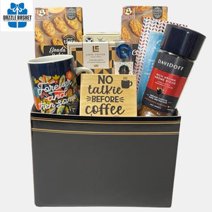 A Calgary gift basket for all coffee lovers. It comes with a coffee mug & a "No talkie before coffee" wooden magnetic sign in addition to delicious gourmet snacks that one can relish with a cup of coffee.