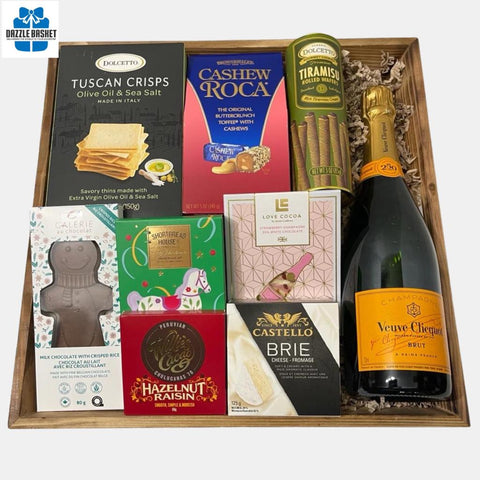Finest champagne gift baskets Calgary offers- This Celebrate with Style gift basket a bottle of Veuve champagne & delicious gourmet snacks in a large wooden tray..