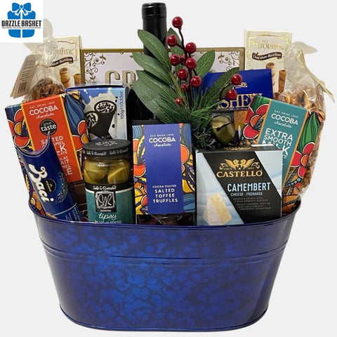Gift baskets Calgary-Dazzle Basket- Royal gift basket is a holiday themed basket that includes delicious gourmet snacks in a beautiful royal blue metal container.