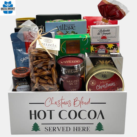 A Calgary Holiday gift baskets comprising of holiday themed gourmet snacks packed neatly in a rectangular white container