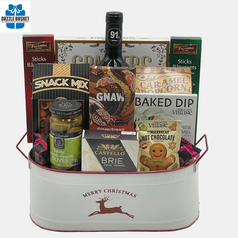 An award winning wine with tasty gourmet snacks placed perfectly in a beautiful white Christmas metal container make up this  popular made in Calgary Holiday gift basket.