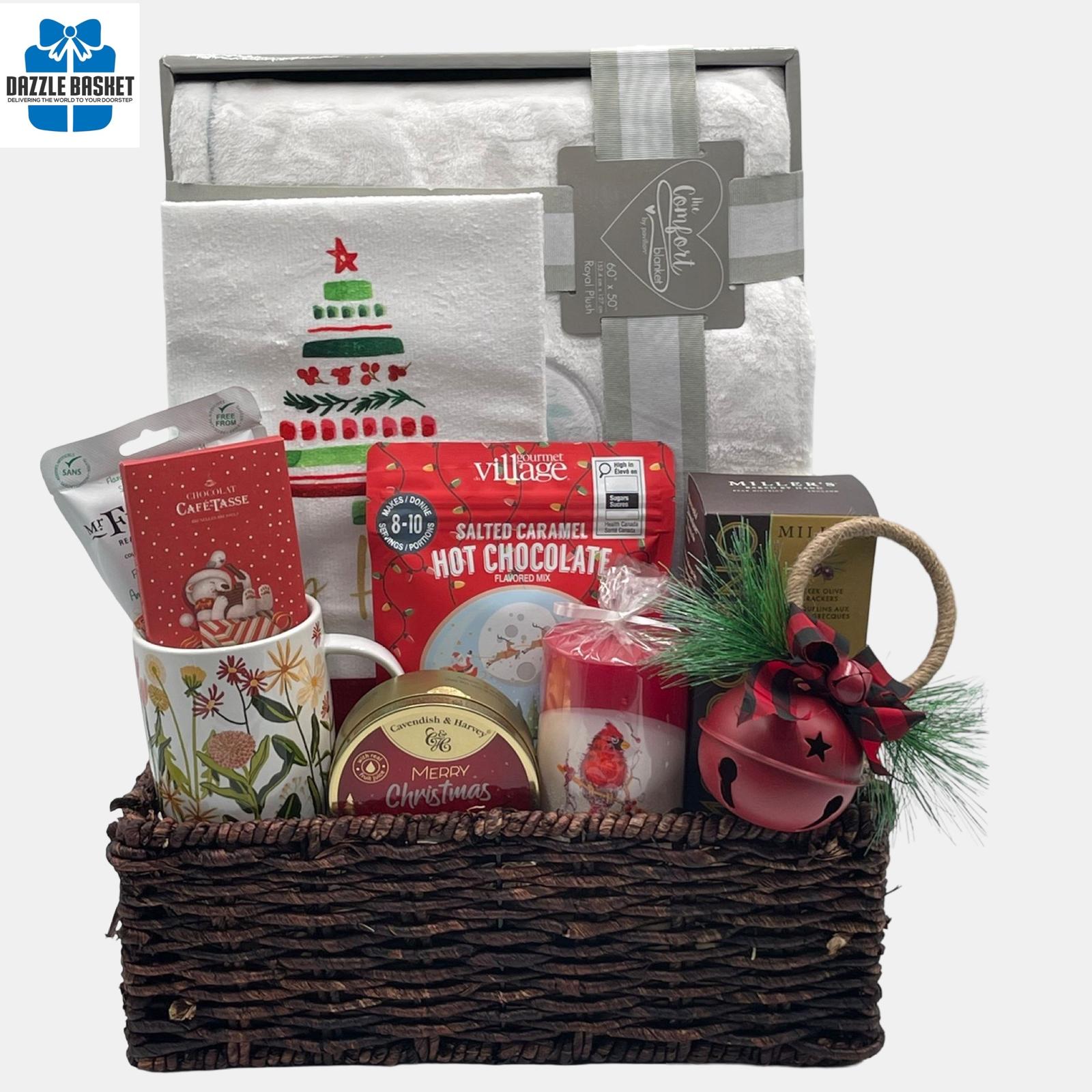 A holiday themed made in Calgary gift basket that includes a plush blanket, tea towel, holiday candle and delicious gourmet snacks arranged in a large corn tray.