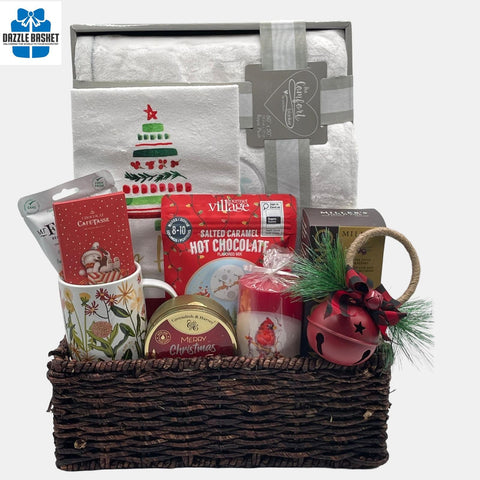 A holiday themed made in Calgary gift basket that includes a plush blanket, tea towel, holiday candle and delicious gourmet snacks arranged in a large corn tray.