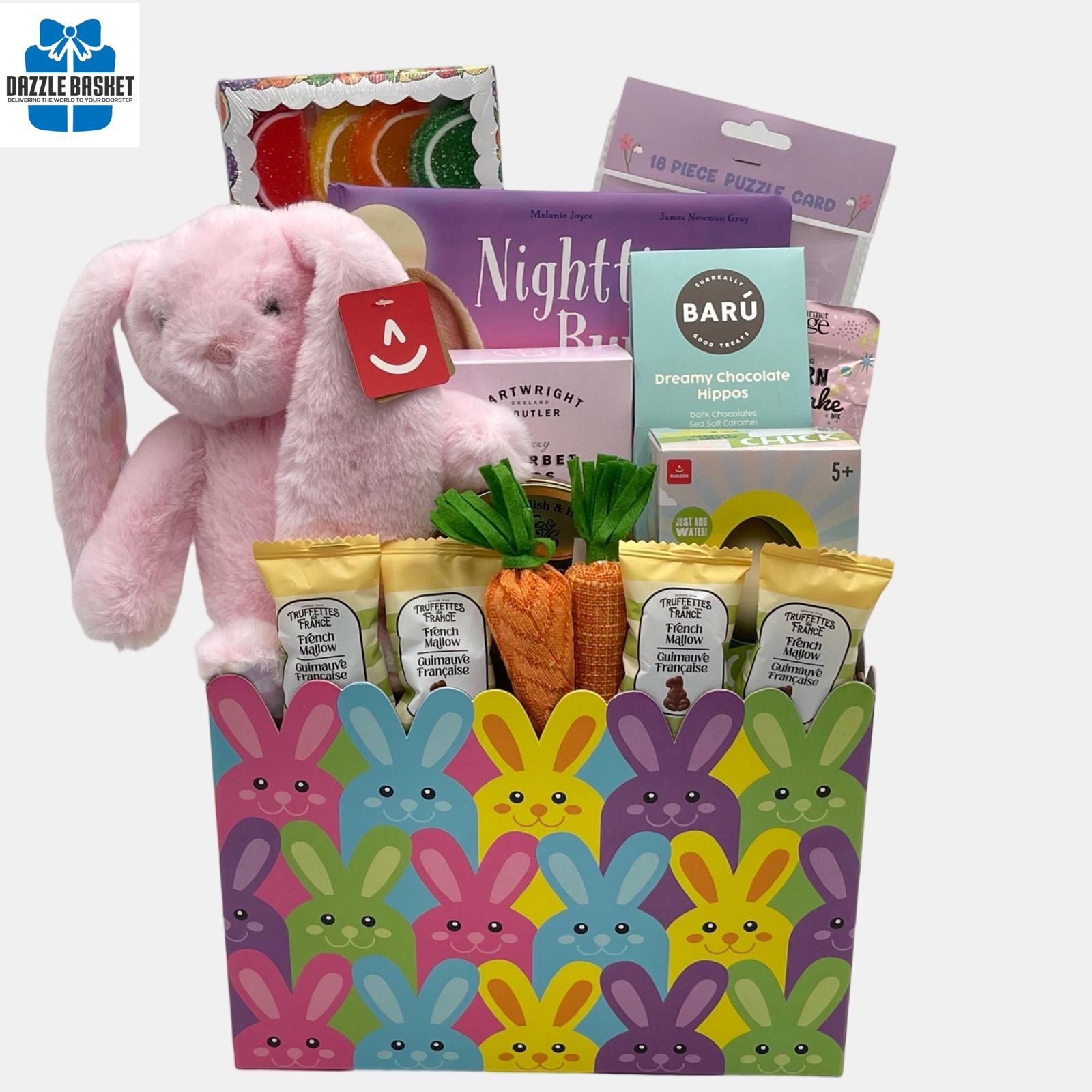 A Calgary Easter gift basket with Easter bunny plush toy and themed chocolates and gourmet snacks arranged beautifully in a bunny themed box.