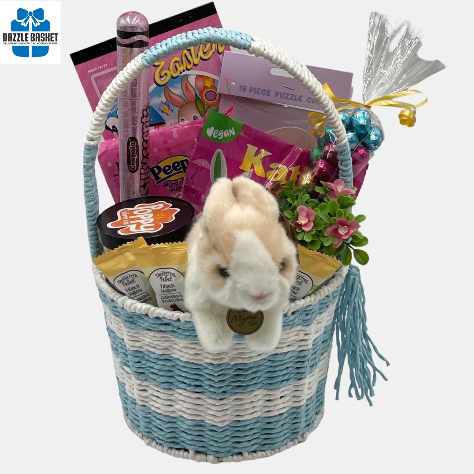 A Calgary Easter gift basket with large bunny plush toy and  Easter themed chocolates and gourmet snacks arranged beautifully in a blue & white basket with handle.