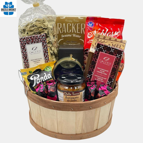A Calgary food gift basket filled with delicious snacks & chocolates in a natural round bushel.