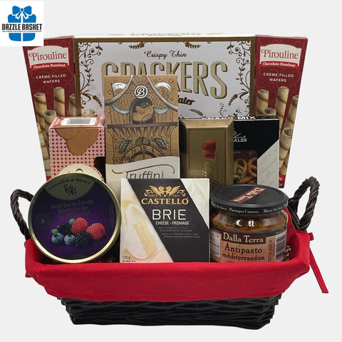 A made in Calgary food gift basket that includes top of the line delicious gourmet snacks in a rectangular basket with red liner.