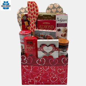 Made in Calgary Valentine gift basket filled with red color themed gourmet snacks in a ed box.