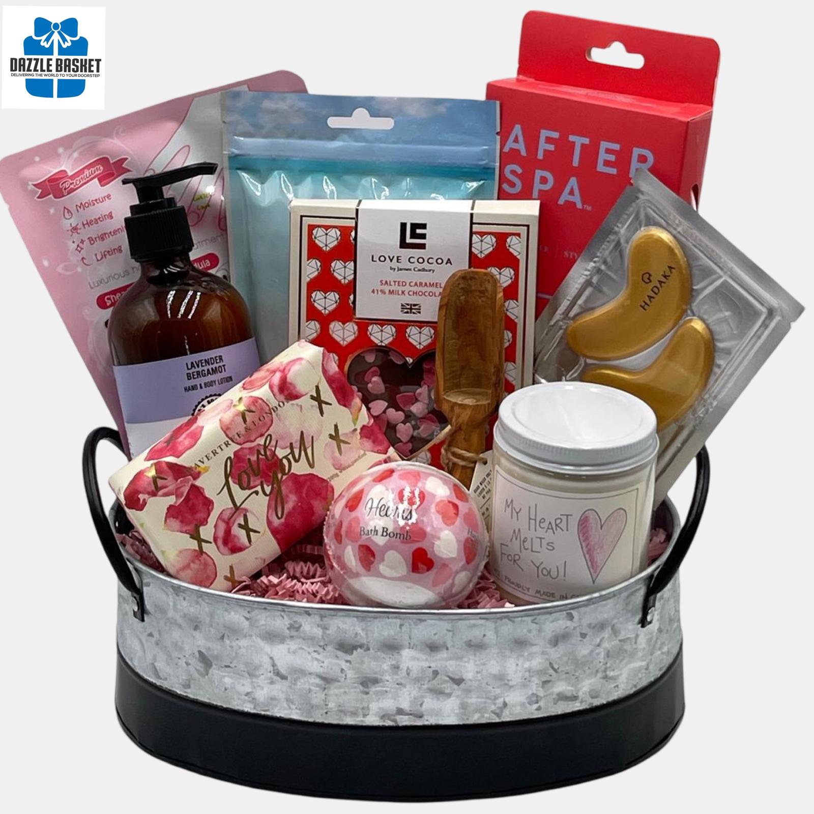 A Valentine themed Calgary Spa gift basket that contains love themed spa products arranged beautifully in a galvanized oval metal container.