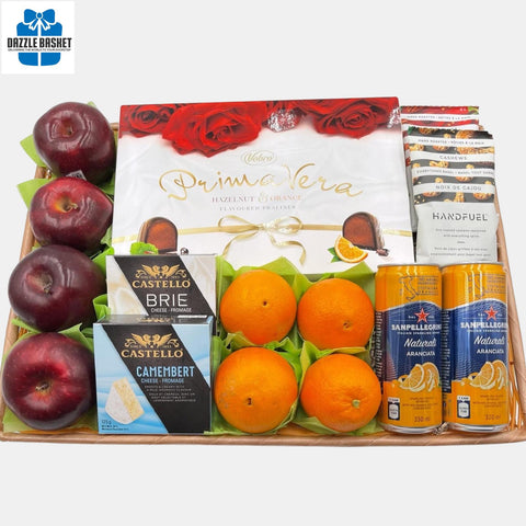A made in Calgary fruits basket  that includes fresh fruits, box of chocolates, cheese, jam, snacks, sparkling water arranged neatly in rectangular synthetic basket