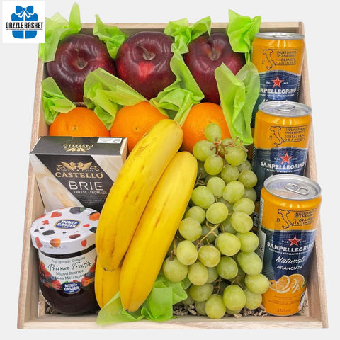 A made in Calgary fruits basket  that includes fresh fruits, cheese, jam, sparkling water arranged neatly in rectangular natural wood crate.