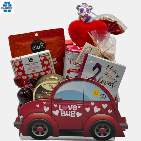 GIft baskets calgary from Dazzle Basket- Great Valentine Day gift that includes lots of chocolates and delicious food products in a beetle car shaped box with Love Bug written on it.