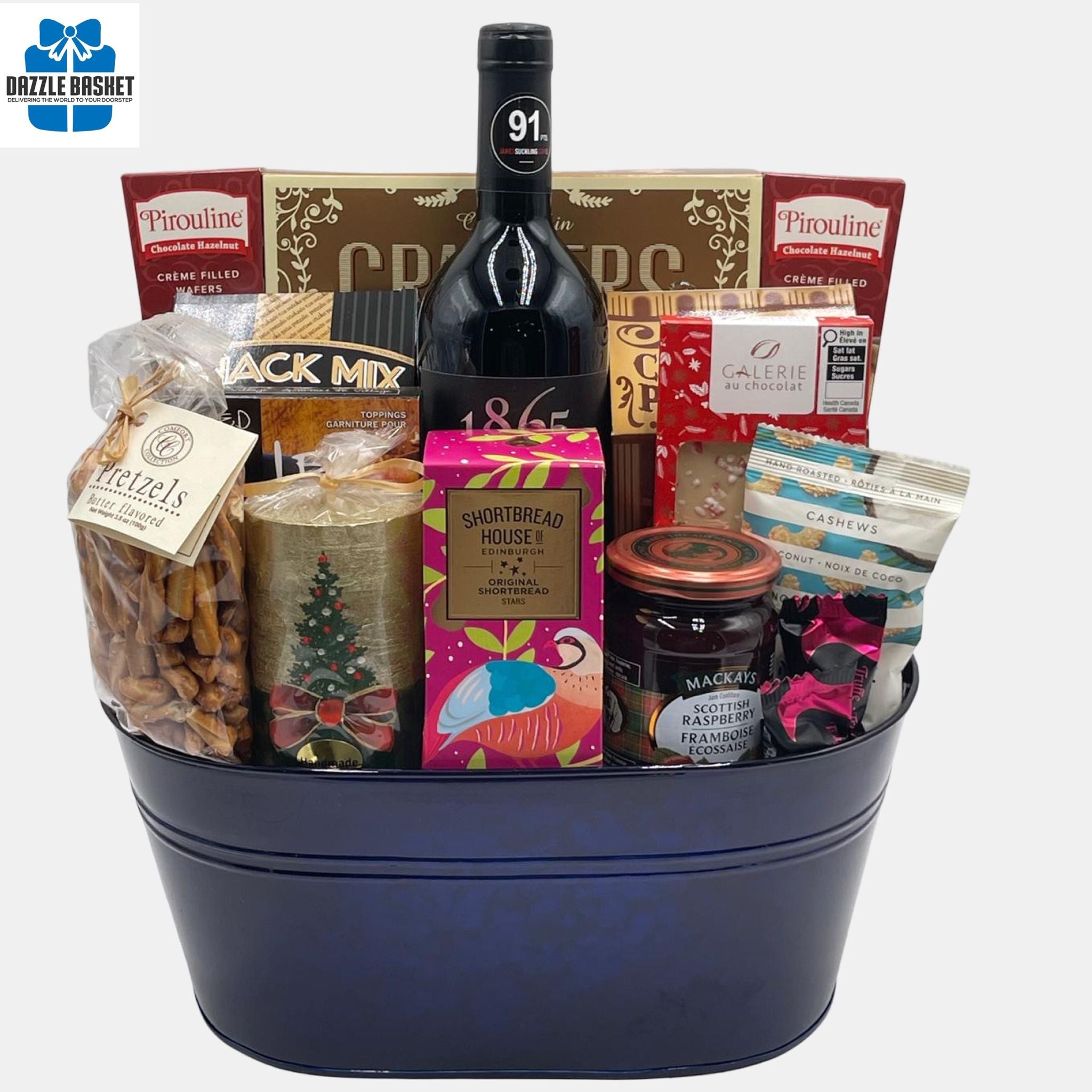 A Calgary holiday wine gift basket containing an assortment of gourmet snacks and treats, including Christmas-themed items such as a holiday candle, shortbread and various gourmet snacks and a bottle of wine.