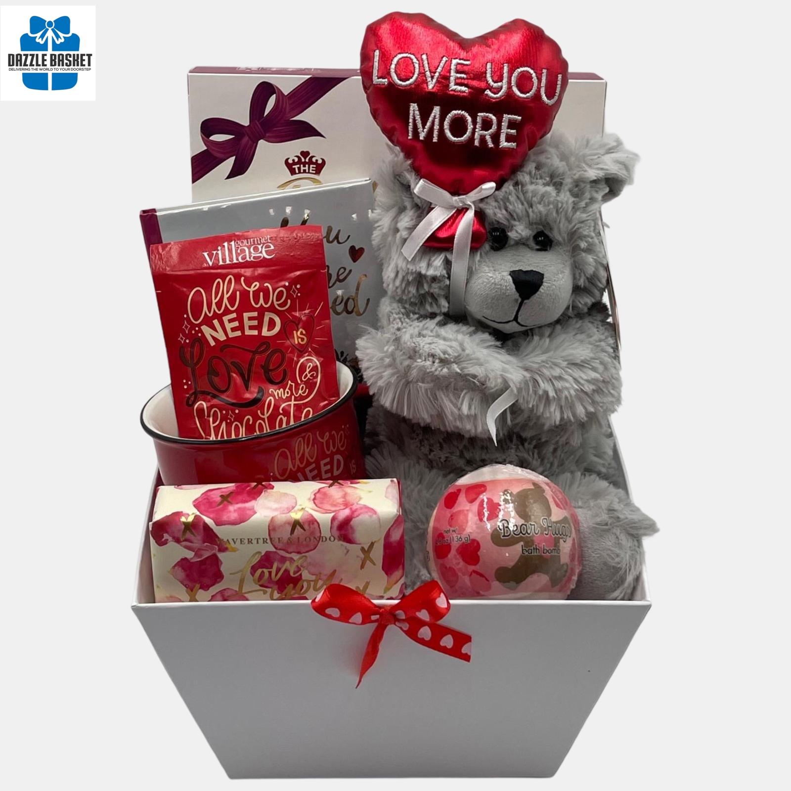 Love Gift baskets Calgary from Dazzle Basket- A Valentine themed gift basket that includes delicious gourmet snacks i& spa products arranged neatly in a market tray.