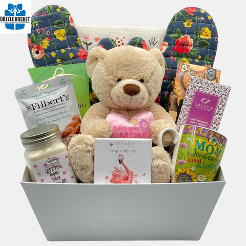 Perfect gift for Mom that includes mom specific products including a teddy bear, Mom mug, compact mirror with several other gourmet snacks.