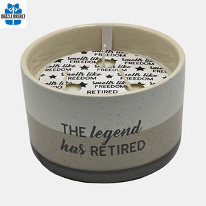 This 12 oz 100% soy wax jasmine tranquility-scented candle fills a smooth-edged ceramic vessel with a decal "The Legend has Retired".