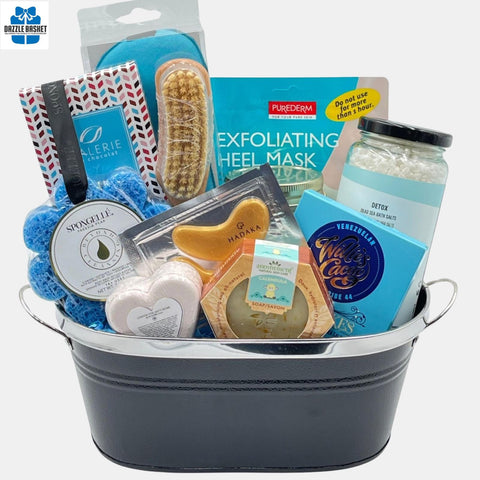 A made in Calgary spa gift basket that includes top quality spa products & chocolates in a black metal container.