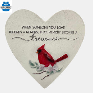 Heart-shaped 11"garden stone with a red cardinal and floral design, featuring an inspirational quote remembering a loved one.