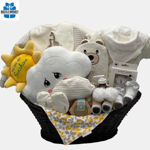 A unisex baby gift basket that includes quality baby products and a beautiful "You are my Sunshine" plush toy packed in a lovely oval basket with a pedestal.