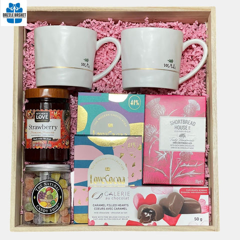 A Calgary anniversary gift box with Mr & Mrs themed mug set, delicious chocolates and handmade shortbread.