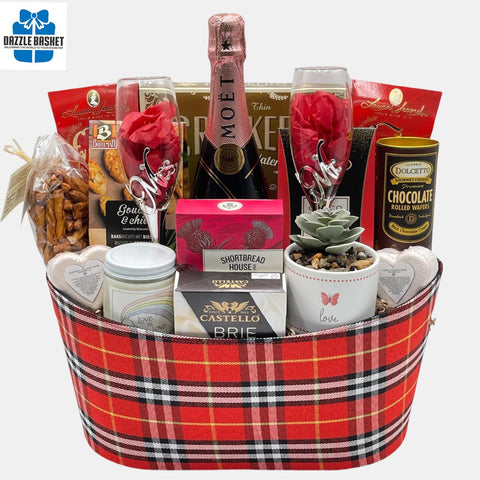 A Calgary wedding/anniversary gift basket with Mr & Mrs themed flute glass set, bottle of Rose champagne  & delicious gourmet snacks.