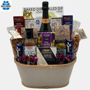 A made in Caqlgary gift basket that includes an award winning red wine, delicious gourmet snacks organized neatly in a cream golden container. It is one of our most popular basket.