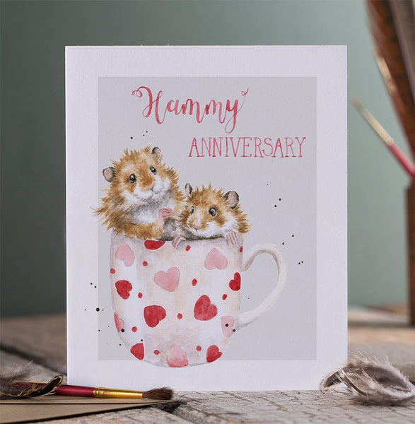 A greeting that has 2 little mice in a cup and front of the card reads "Hummy Anniversary"