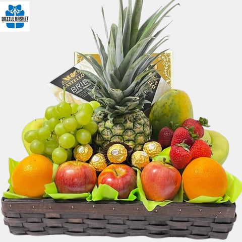 A made in Calgary fresh fruits basket in addition to chocolates, crackers and cheese arranged neatly in rectangular brown woodchip tray.