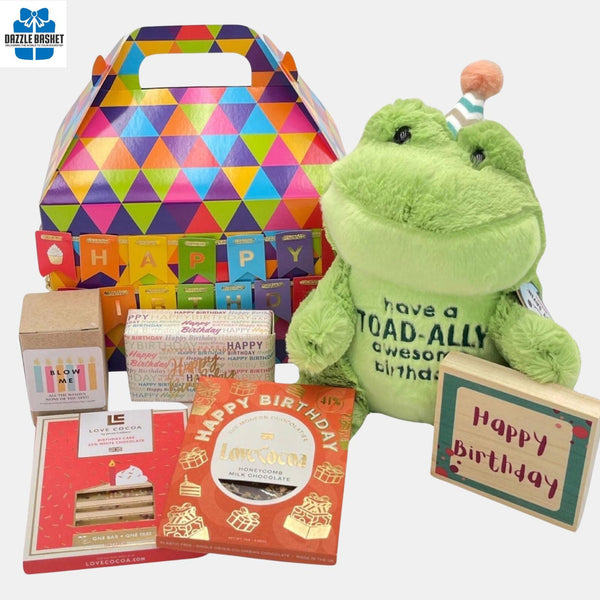 Calgary birthday gift box from Dazzle Basket- A gable box that contains all essentials for a birthday celebration including a candle, chocolate, wooden plaque and much more.