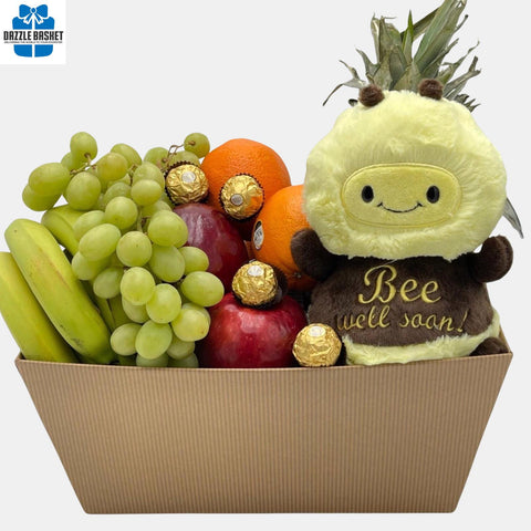 A made in Calgary Get well soon gift basket with delicious gourmet snacks and "Bee Well Soon" bee plush toy packed in a large rectangular open box..