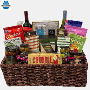 A Calgary gift basket from Dazzle Basket: Massive basket that comes with a huge collection of delicious gourmet snacks and 2 bottles of wine packed in a large corn tray. 