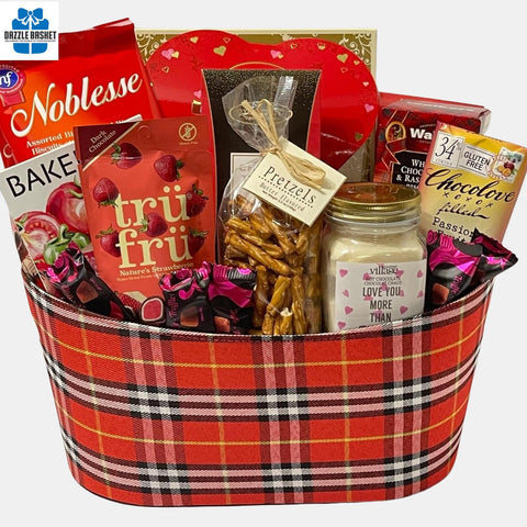 Love Gift basket Calgary from Dazzle Basket-A red color themed valentine gift basket that includes delicious gourmet snacks including cookies and chocolates made in a red faux leather oval container